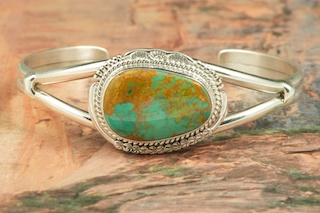 Genuine Crow Springs Turquoise set in Sterling Silver Bracelet. The Crow Springs Mine is located near Tonopah, Nevada. Created by Navajo Artist John Nelson. Signed by the artist.